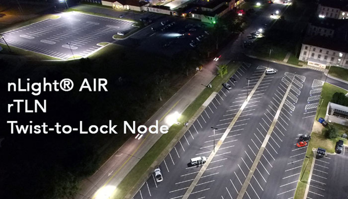 The nLight rTLN lighting controls solution shown being used, at night, in a large parking lot.